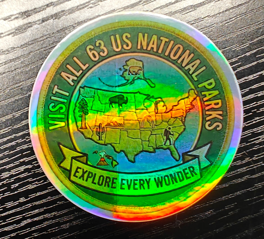 Visit All 63 U.S. National Parks holographic vinyl sticker featuring a map of the United States with National Park icons.